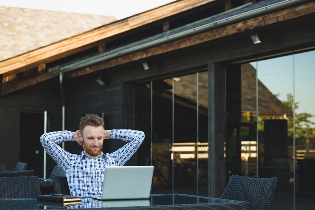 Handsome businessman working with laptop